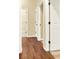 Hallway featuring hardwood floors and neutral wall color at 2949 Spotted Pony Nw Ct, Acworth, GA 30101