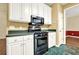 Kitchen featuring black appliances and white cabinets for a modern cooking experience at 2949 Spotted Pony Nw Ct, Acworth, GA 30101