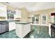 Well-lit kitchen featuring white cabinets, an island, and stainless steel appliances at 2949 Spotted Pony Nw Ct, Acworth, GA 30101