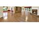 Expansive living room with hardwood floors, fireplace, large windows and furniture at 2949 Spotted Pony Nw Ct, Acworth, GA 30101