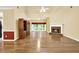 Spacious living room featuring hardwood floors, a fireplace, and large windows for ample natural light at 2949 Spotted Pony Nw Ct, Acworth, GA 30101