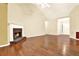 Well lit Living room featuring hardwood floors, a fireplace, and an entryway at 2949 Spotted Pony Nw Ct, Acworth, GA 30101