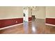 Hardwood flooring in a well lit area, with entry to the kitchen and living room with fireplace at 2949 Spotted Pony Nw Ct, Acworth, GA 30101
