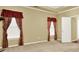 Main bedroom with carpet and decorative window treatments at 2949 Spotted Pony Nw Ct, Acworth, GA 30101