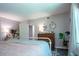 Cozy bedroom with a vintage vanity and a window draped with light, sheer curtains at 3006 Durban Ct, Decatur, GA 30034