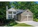 Charming two-story home featuring a two-car garage, well-manicured lawn, and a welcoming front porch at 3006 Durban Ct, Decatur, GA 30034