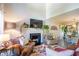 Cozy living room with a fireplace, plush seating, and plenty of natural light at 3006 Durban Ct, Decatur, GA 30034