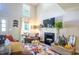 Bright living room with a fireplace, comfortable seating, and tall ceilings at 3006 Durban Ct, Decatur, GA 30034