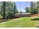 Expansive backyard with new wooden fence and view of deck at 510 Whistlestop Dr, Woodstock, GA 30189