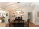 Well-lit dining area with a large wooden table and stylish decor at 510 Whistlestop Dr, Woodstock, GA 30189