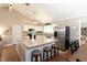 Bright open kitchen featuring a center island, stainless steel appliances, and a breakfast bar at 510 Whistlestop Dr, Woodstock, GA 30189