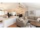 Open floor plan with living room featuring a kitchen with stainless steel appliances and a large island at 510 Whistlestop Dr, Woodstock, GA 30189