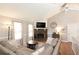 Cozy living room features a stone fireplace, vaulted ceiling, and a comfortable sectional sofa at 510 Whistlestop Dr, Woodstock, GA 30189