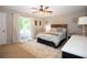 Bedroom with a sliding door to the outside, ceiling fan, and neutral colors at 510 Whistlestop Dr, Woodstock, GA 30189