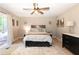 Cozy bedroom with neutral colors, comfortable bedding, dresser and sliding glass doors at 510 Whistlestop Dr, Woodstock, GA 30189