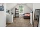 Neutral colored room with desk and bookshelf, small gray loveseat, and soft carpeting at 5125 Winding Glen Dr, Lithonia, GA 30038