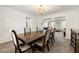 Formal dining room shows view into the living room and its open floorplan at 5125 Winding Glen Dr, Lithonia, GA 30038