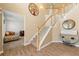 Inviting foyer with hardwood floors, a staircase with white railings, and stylish decor at 5125 Winding Glen Dr, Lithonia, GA 30038