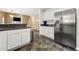 Open kitchen featuring stainless steel refrigerator and easy access to dining and living spaces at 5125 Winding Glen Dr, Lithonia, GA 30038