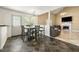 Eat-in kitchen featuring dark gray tiled floors and views of the living area at 5125 Winding Glen Dr, Lithonia, GA 30038