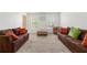 Spacious living room features neutral carpeting, lots of natural light, and stylish furnishings at 5125 Winding Glen Dr, Lithonia, GA 30038