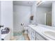 Bathroom featuring double sinks, tile floors, and a shower at 1015 Carriage Way, Loganville, GA 30052