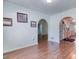 Inviting dining room with wood floors and arched doorways to other rooms at 1015 Carriage Way, Loganville, GA 30052