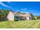 Well-maintained lawn and manicured bushes surrounding this charming home with classic architecture at 1015 Carriage Way, Loganville, GA 30052