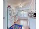 Well-lit kitchen features white cabinets and stainless steel appliances at 1015 Carriage Way, Loganville, GA 30052