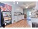 Spacious kitchen with granite countertops, white cabinets, and laminate floors at 1015 Carriage Way, Loganville, GA 30052