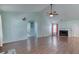 Spacious living room features hardwood floors, vaulted ceiling, and a cozy fireplace at 1015 Carriage Way, Loganville, GA 30052