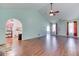 Spacious living room with archway to the kitchen and hardwood flooring at 1015 Carriage Way, Loganville, GA 30052
