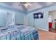 Light and airy main bedroom with trey ceilings, fan, TV and access to ensuite bathroom at 1015 Carriage Way, Loganville, GA 30052
