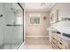 Bright bathroom with large shower, vanity, neutral tile, and window at 2796 County Line Rd, Acworth, GA 30101