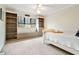 Comfortable bedroom with built-in shelving, a window seat, and ample natural light at 2796 County Line Rd, Acworth, GA 30101