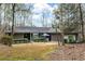 Charming single-story home with well-kept lawn and attached two-car garage in a wooded setting at 2796 County Line Rd, Acworth, GA 30101