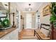 Welcoming foyer featuring warm hardwood floors, a bench, and tasteful decor at 2796 County Line Rd, Acworth, GA 30101