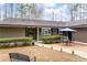 This home boasts a serene outdoor seating area and lovely, low-maintenance landscaping at 2796 County Line Rd, Acworth, GA 30101