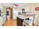 Bright kitchen with white cabinets, a breakfast bar, and stainless steel appliances at 2796 County Line Rd, Acworth, GA 30101