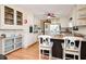 Spacious kitchen with white cabinets, an island with seating, and hardwood floors at 2796 County Line Rd, Acworth, GA 30101