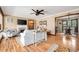 Cozy living room featuring hardwood floors, a fireplace, and a dining area at 2796 County Line Rd, Acworth, GA 30101