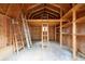 Interior view of the wooden shed with ladders, built in shelves, and wooden frame at 2796 County Line Rd, Acworth, GA 30101
