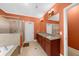 Bathroom featuring a double vanity, granite countertop, and separate shower and soaking tub for ultimate relaxation at 3086 Frazier Walk, Decatur, GA 30033