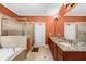 Bathroom with a dual vanity, soaking tub, and glass-enclosed shower create a spa-like experience at 3086 Frazier Walk, Decatur, GA 30033