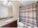 Bathroom featuring granite vanity, decorative mirror, and shower with curtain at 3086 Frazier Walk, Decatur, GA 30033