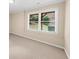 Bedroom featuring neutral carpet, natural light from the window, and neutral painted walls at 3086 Frazier Walk, Decatur, GA 30033