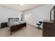 Bright bedroom with carpet, natural light from the window, and furnished with bed and desk at 3086 Frazier Walk, Decatur, GA 30033
