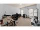 Spacious bedroom featuring neutral walls and carpet, with ample natural light from two windows at 3086 Frazier Walk, Decatur, GA 30033