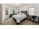Bright bedroom with three windows, carpet, and an attached desk at 3086 Frazier Walk, Decatur, GA 30033