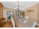 Formal dining room featuring hardwood floors, chandelier, and tan walls at 3086 Frazier Walk, Decatur, GA 30033
